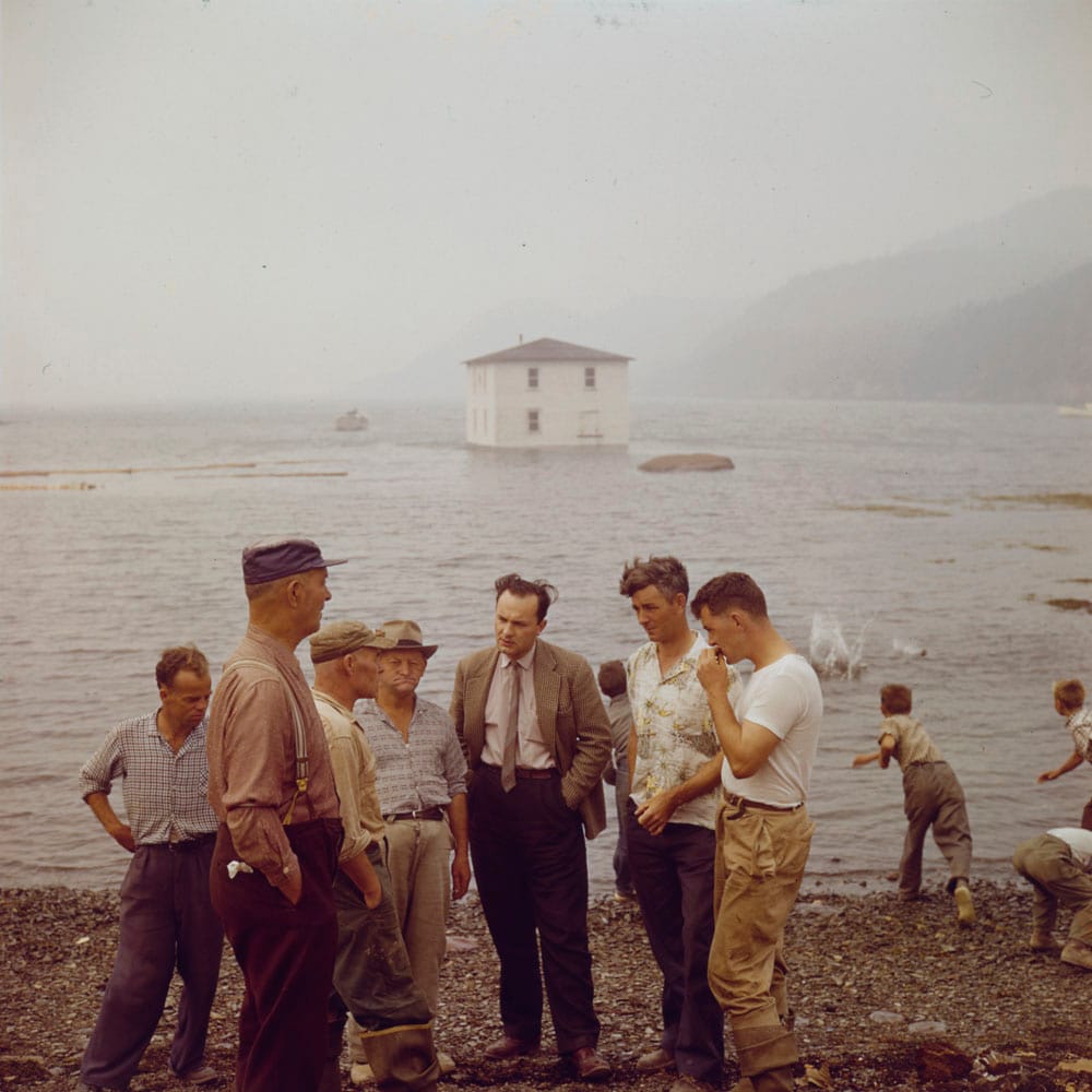 A house being moved by floating it from Silver Fox Island, Bonavista Bay, to Dover, Newfoundland, 1961 Photo: Bob Brooks